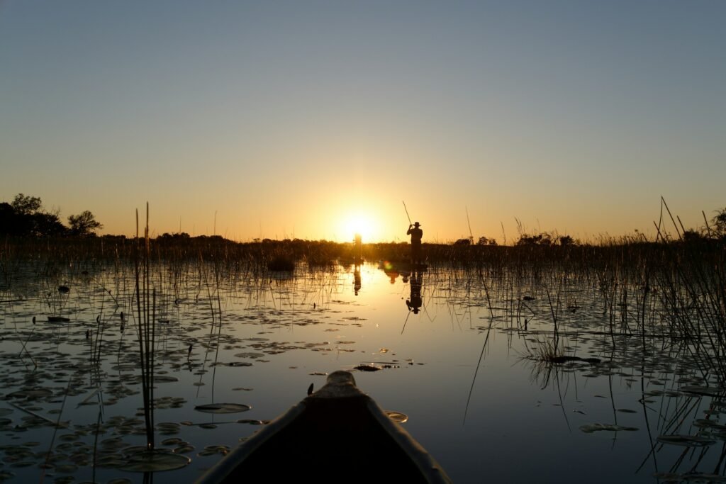 Mokoro on sunset by Xplorer's Edge Tours and Safaris